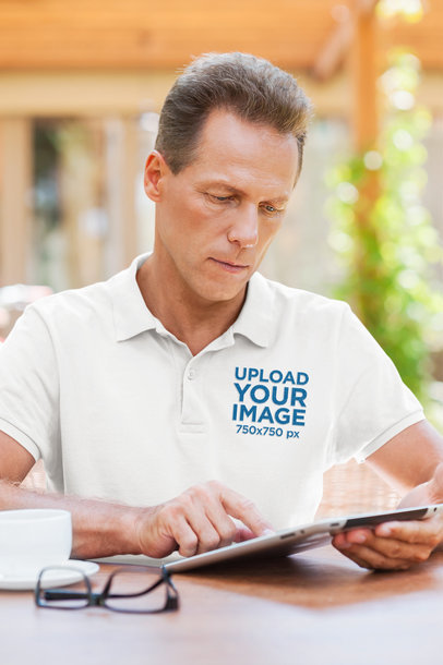 Polo Shirt Mockup of a Serious Man Checking a Tablet m10794 r-el2