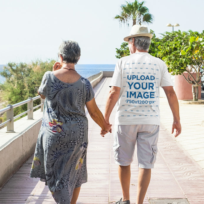 Back-View T-Shirt Mockup of a Man Walking With His Wife