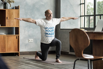 Round-Neck Tee Mockup of a Man Doing Yoga at Home