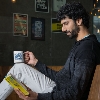11 oz Coffee Mug Mockup of a Bearded Man Reading a Book