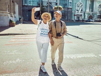T-Shirt Mockup Featuring an Elderly Couple Taking a Selfie