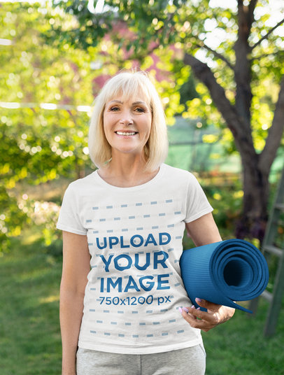 T-Shirt Mockup of a Happy Senior Woman With a Yoga Mat