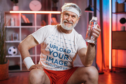 Crewneck Tee Mockup of an Elderly Man in Activewear Smiling at the Camera