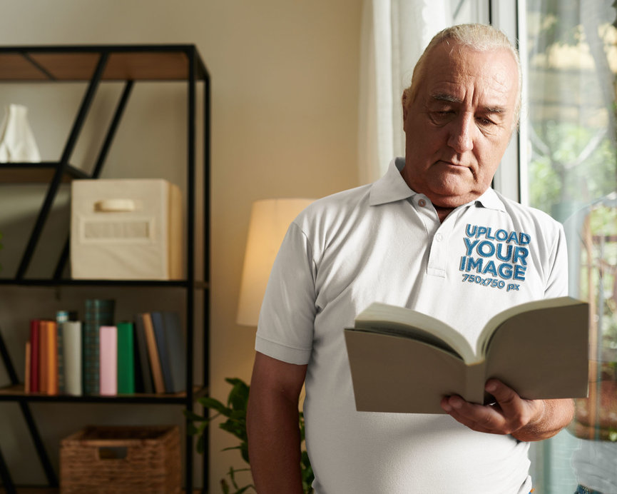 Polo Shirt Mockup Featuring a Senior Man Reading a Book