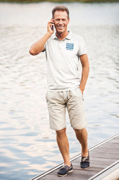 Polo Shirt Mockup Featuring a Smiling Man on the Phone m10589 r-el2
