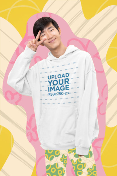 Hoodie Mockup of a Happy Man Featuring a Doodle Background