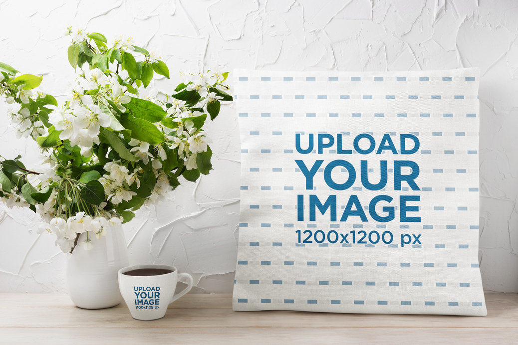 Mockup of a Squared Pillow Placed Next to a Flower Pot and a Coffee Mug