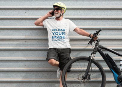 Round-Neck T-Shirt Mockup Featuring a Happy Senior Man With a Bike Talking on the Phone m18267 r-el2