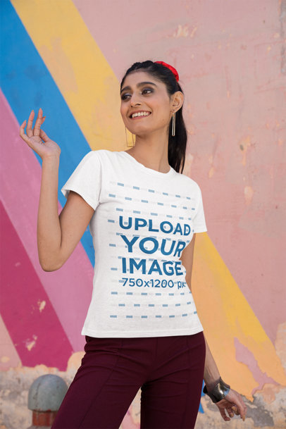 Gildan T-Shirt Mockup of a Happy Woman Posing Against a Colorful Wall