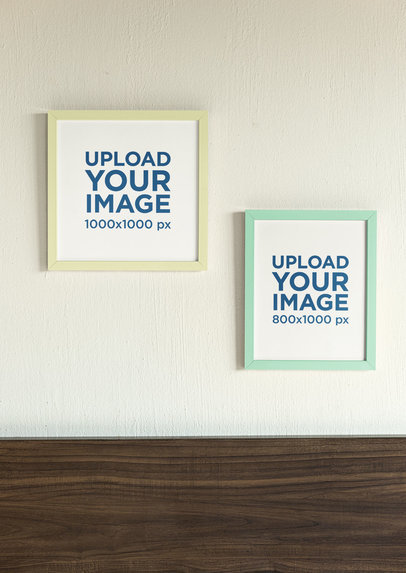 Mockup of Two Art Prints Hanging Against a Wall