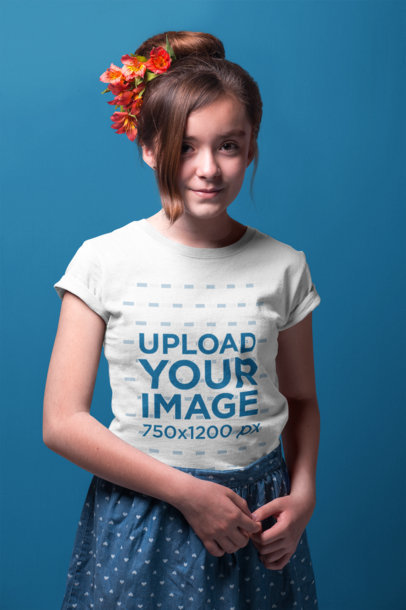 Portrait of a Little Girl Wearing a T-Shirt Mockup Against a Solid Background