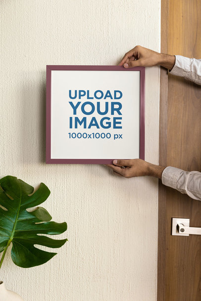Mockup of a Person Holding a Squared Art Print