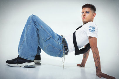 Y2K-Aesthetic Mockup of a Man Posing at a Studio with a Bella Canvas T-Shirt