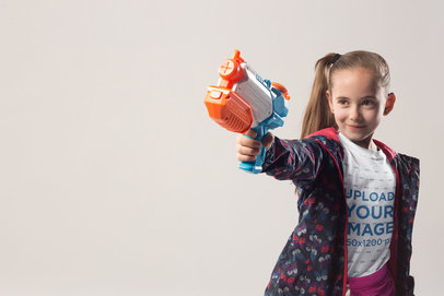 Blonde Girl Wearing a T-Shirt Mockup Shooting a Water Gun a19734