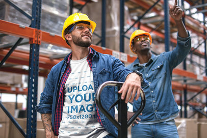 Industrial Worker Wearing a T-Shirt Mockup with his Friend at the Warehouse