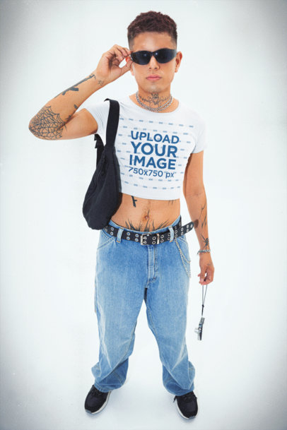 00s-Themed Mockup Featuring a Tattooed Man Wearing a Bella Canvas Crop Top 