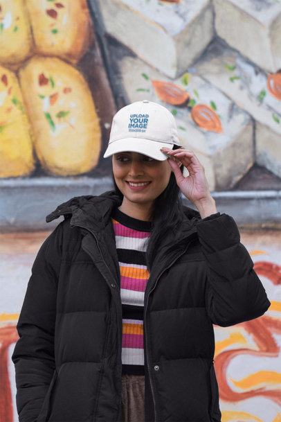 Dad Hat Mockup of a Happy Woman Posing Near a Colorful Wall