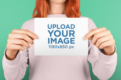 Horizontal Post Card Mockup Being Held by a Woman