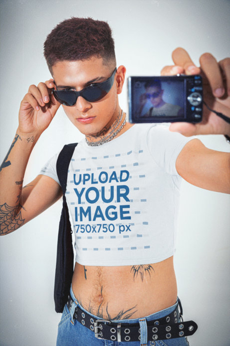 Bella Canvas Crop Top Mockup Featuring a Man Taking a Selfie With an Old Camera