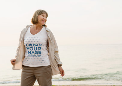 Mockup of a Senior Woman Posing with a V-Neck T-Shirt on the Beach m28580 r-el2