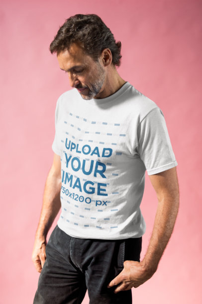 Portrait of a Man Posing Wearing a T-Shirt in a Pink Room