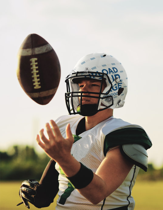 Helmet Mockup of a Football Player on a Field