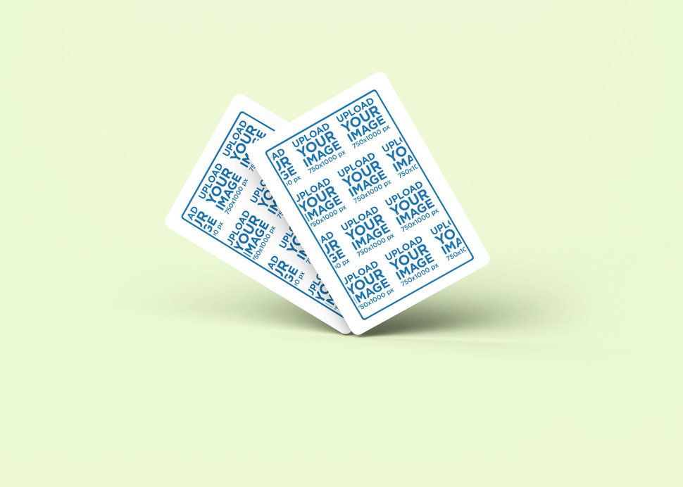 Mockup of Two Playing Cards Standing on a Customizable Backdrop