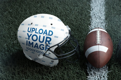 Mockup of a Sublimated Helmet Placed Next to a Football 