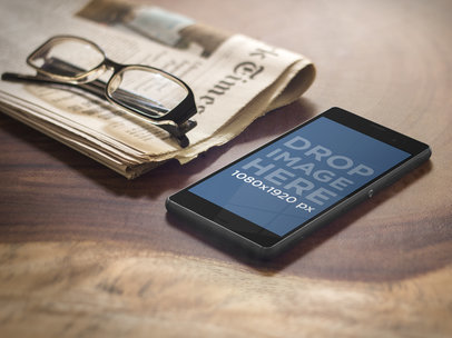 Sony Xperia Mockup Featuring a Newspaper