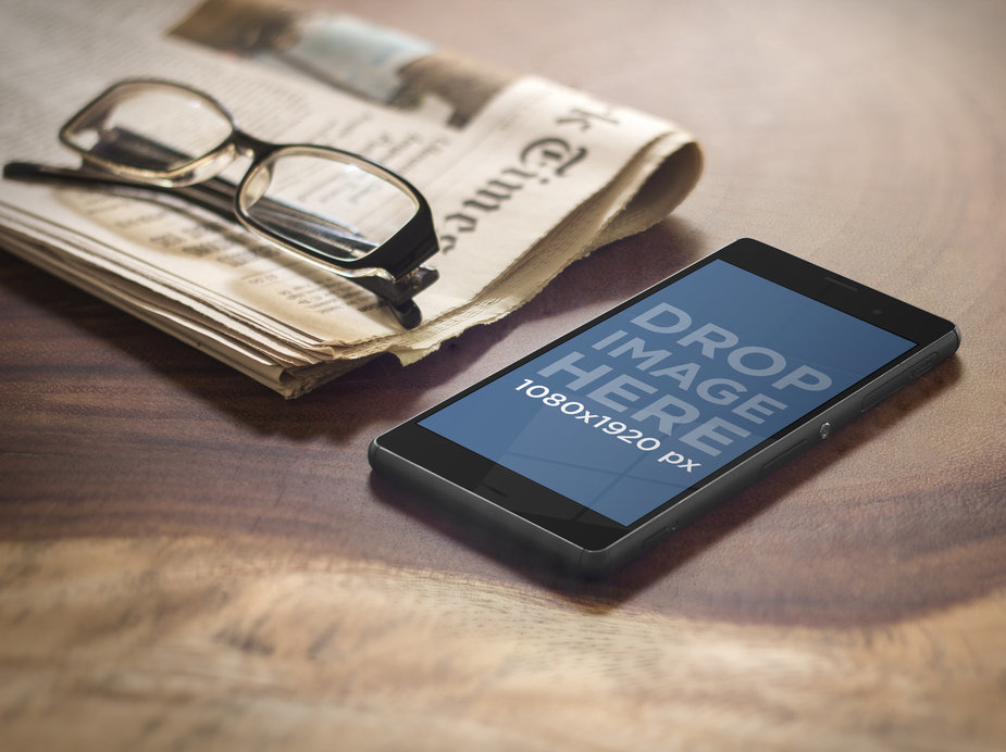 Sony Xperia Mockup Featuring a Newspaper