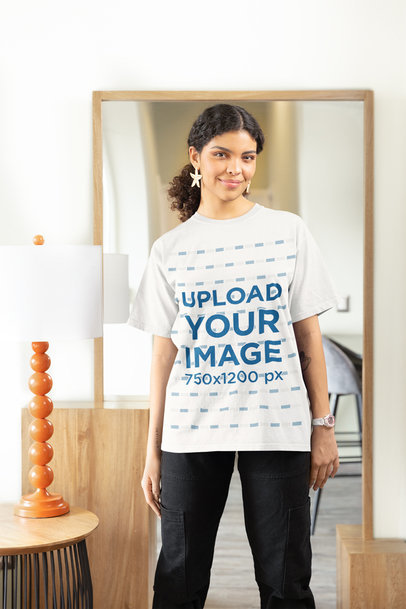 Gildan T-Shirt Mockup of a Woman with Curly Hair Posing in Her Living Room