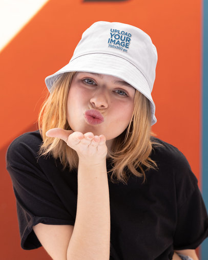 Embroidered Bucket Hat Mockup of a Woman Blowing a Kiss at the Camera