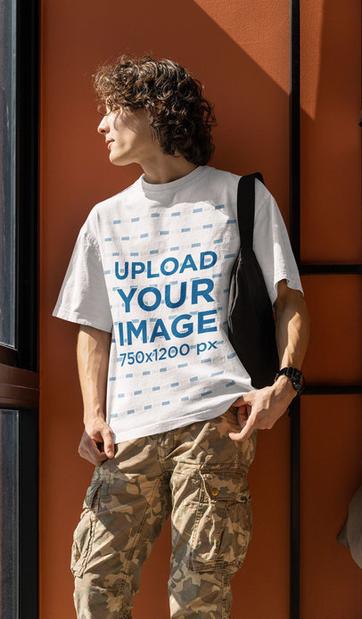 Round-Neck T-Shirt Mockup Featuring a Serious Curly-Haired Man