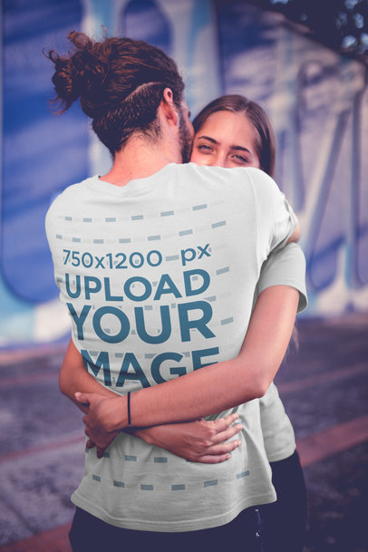Long-Haired Man Wearing a T-Shirt Mockup Hugging his Girlfriend