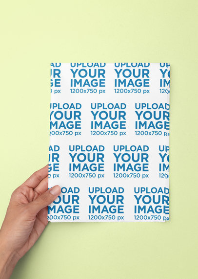 Mockup of a Person Holding a Folded Wrapping Paper m31351