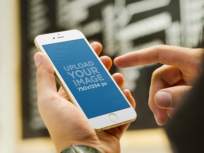 Mockup of a Man Using a Gold iPhone 6