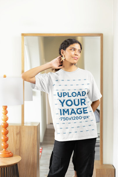 Gildan T-Shirt Mockup of a Smiling Woman Posing Against a Mirror