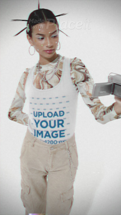 Tank Top Video Featuring a Woman With a Y2K Look Holding an Old Camera