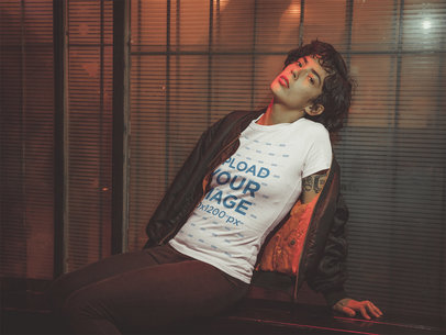 T-Shirt Mockup of a Hispanic Woman Leaning on a Window at Night