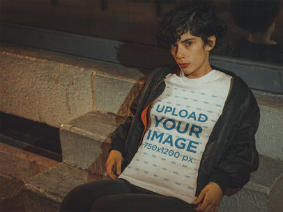 T-Shirt Mockup of a Trendy Woman Wearing a Bomber Jacket at Night