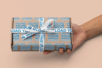 Box Mockup Featuring a Sublimated Ribbon and a Person