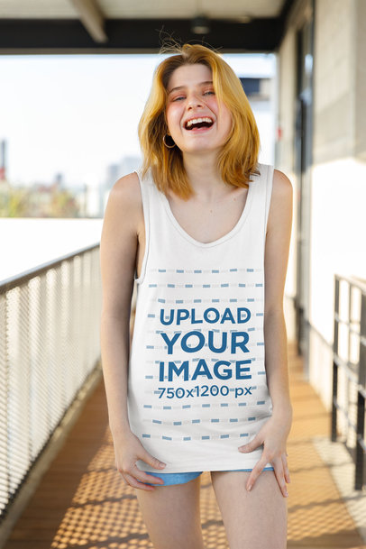 Tank Top Mockup Featuring a Happy Woman with Short Hair Posing on a Balcony