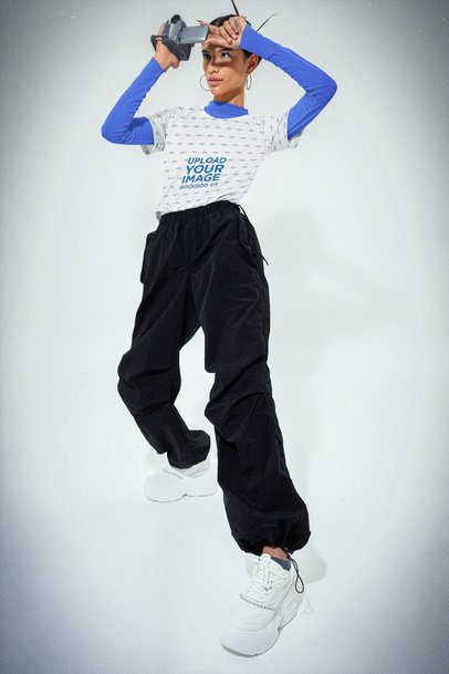 Jersey Mockup of a Woman in a Y2K-Inspired Attire Using a Camcorder