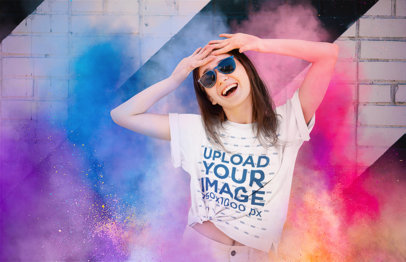 T-Shirt Mockup Featuring a Cheerful Woman Celebrating Holi