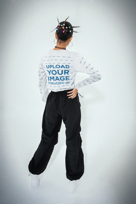 Back View of a Bella Canvas Long Sleeve Tee Mockup Featuring a Woman With a Y2K Style