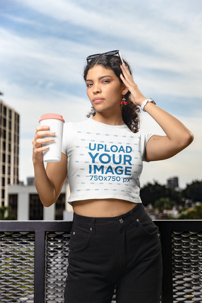 Gildan Crop Top Mockup Featuring a Woman Posing in a Balcony With a Cup of Coffee