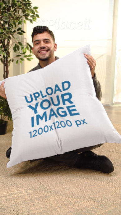Video of a Smiling Man Holding a Sublimated Floor Pillow