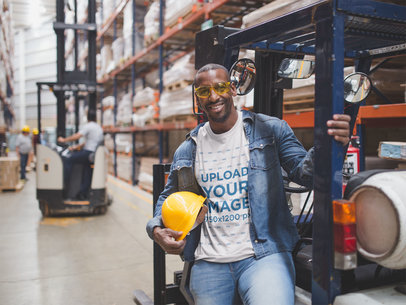 T-Shirt Mockup Featuring a Man Wearing Construction Gear at a Warehouse