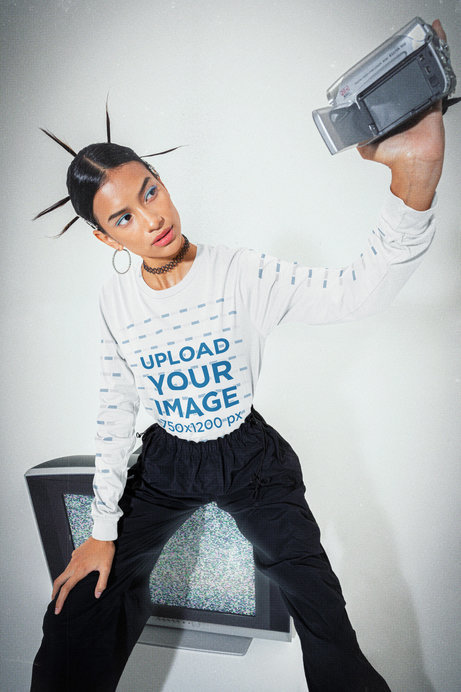 Bella Canvas Long Sleeve Tee Mockup Featuring a Woman Using an Old 00s Camera