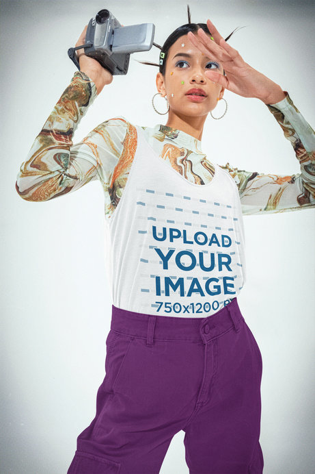 Bella Canvas Tank Top Mockup of a Woman in a Y2K-Style Outfit Holding a Camcorder